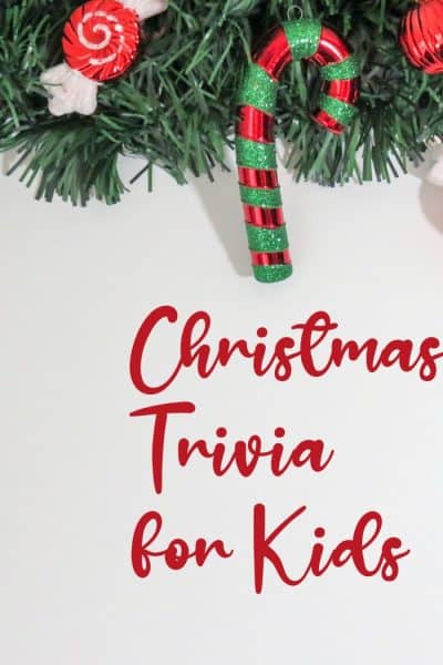 Image of words "Christmas Trivia for Kids" with wreath background.