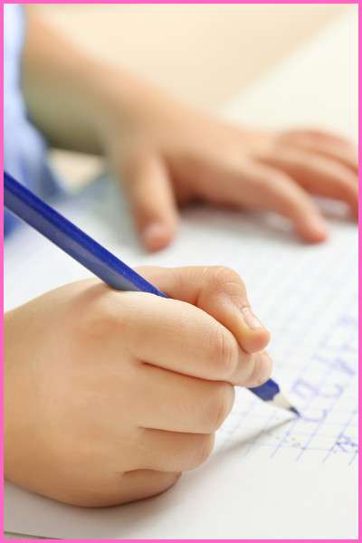 Lined paper for kids. pic of child doing writing practice.