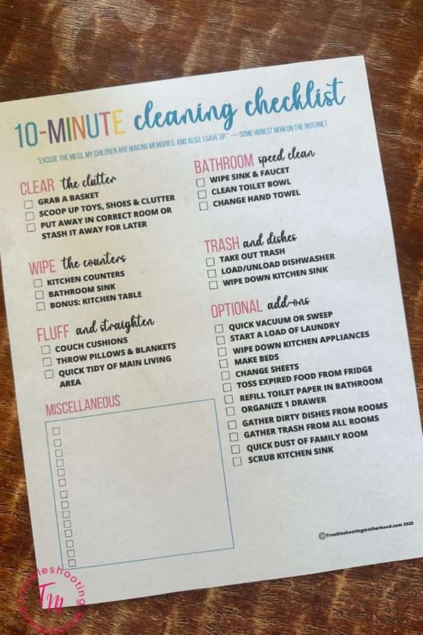 A printed checklist titled "10-Minute Cleaning Checklist" details various quick cleaning tasks for different areas of a house, including clutter-clearing, bathroom speed cleaning, and miscellaneous tasks, designed to facilitate fast house cleaning.