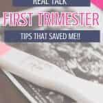 A pregnancy test is placed on a wooden surface next to an ultrasound printout, with text promoting tips for surviving the first trimester.