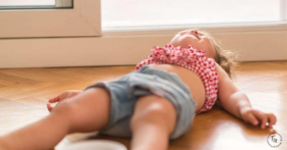 How to diffuse a toddler tantrum. Image of toddler on floor crying. toddler discipline tips. toddler tantrums handling.