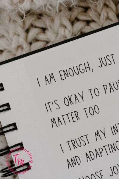 Notebook with self-care affirmations written in simple font, including “I am enough” and “It’s okay to pause.” Perfect for morning affirmations, positive future affirmations, and aesthetic self-affirmation quotes.