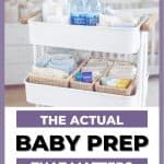 Three-tier white rolling cart organized with baby essentials in a soft nursery setting, including folded baby clothes, diapers, wipes, lotion, and water bottles, with text overlay reading “The Actual Baby Prep That Matters.”