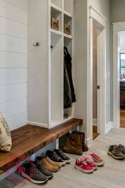 A family entryway with shoes and a backpack on the floor showing how a house gets messy so fast even when you clean.